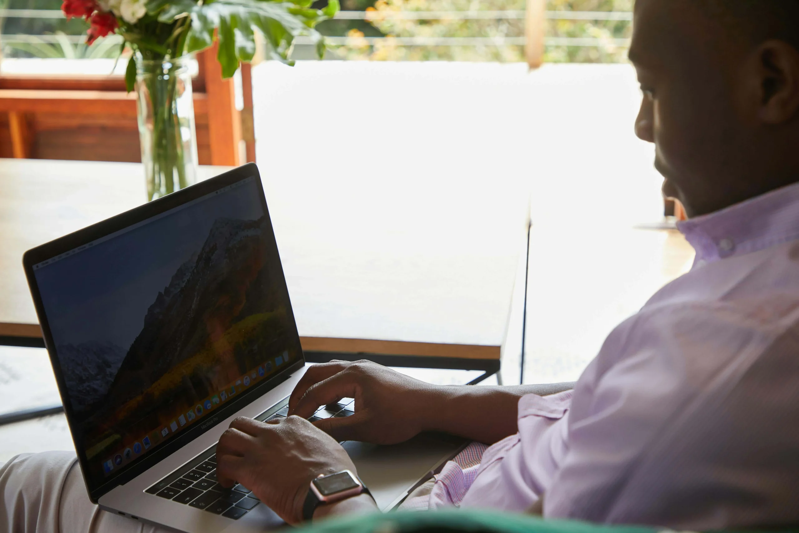 South African business owner reviewing website design quotes on laptop